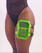 Transparent thigh bag with green mesh pocket worn by a model on a white background